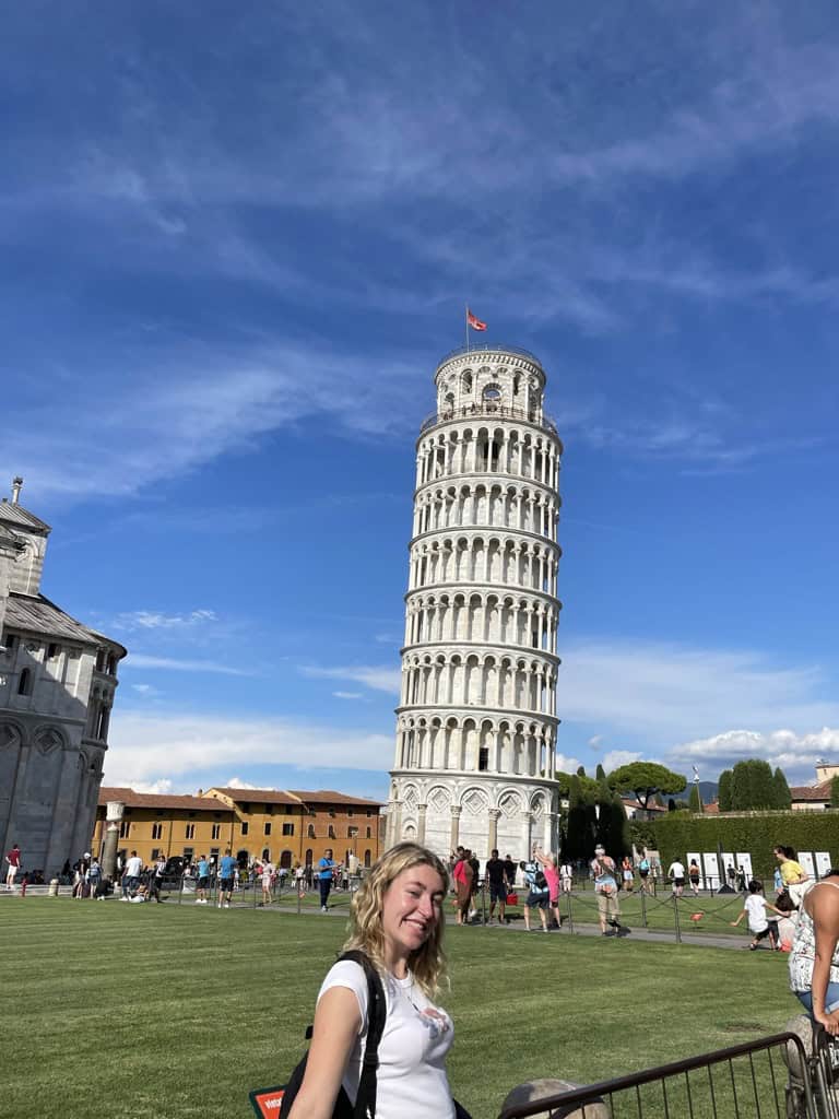 Charlie stood next to the leaning Tower of Pisa