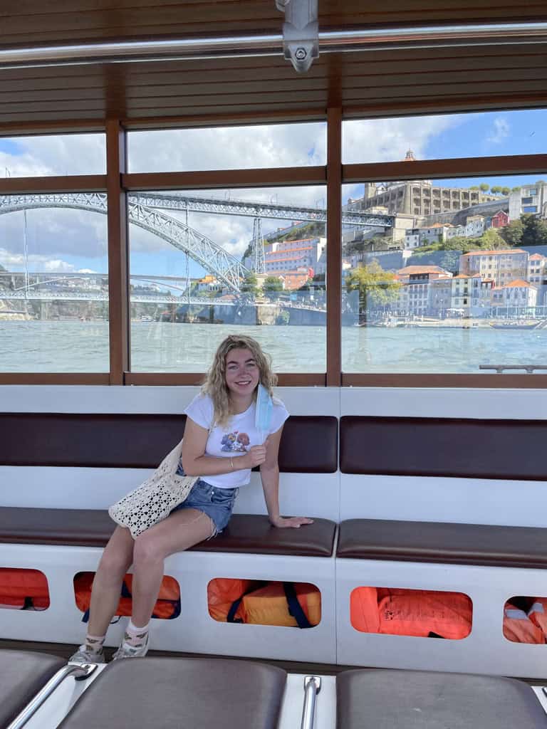 Charlie sat on the water taxi between Porto and Vila Nova de Gaia