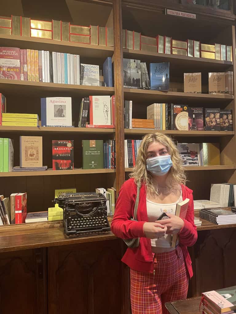 Charlie stood inside of 'A livraria Lello' in Porto, a famous book shop and tourist attraction.