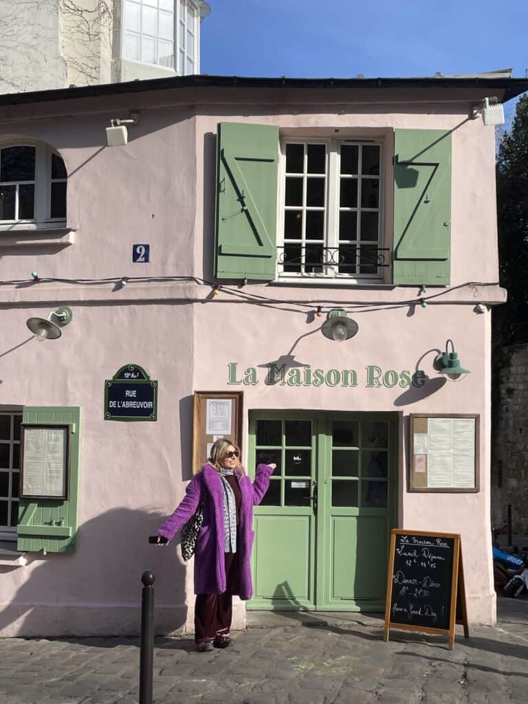 Charlie stood in front of La Maison Rose in Montmatre Paris